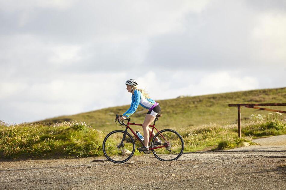 woman riding gravel bike