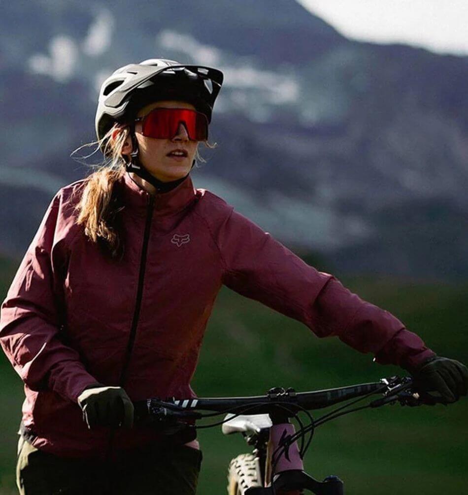 mountain bike woman with bike and gloves