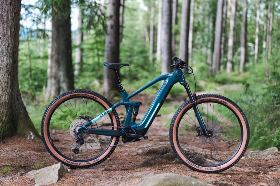 Cube Stereo Hybrid 140 HPC Pro 625 electric mountain bike in forest 1