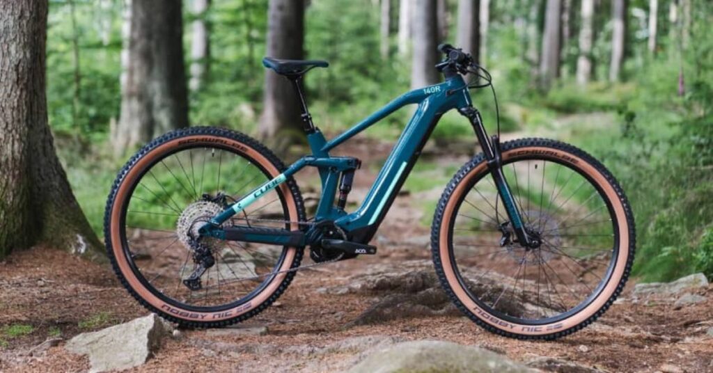 Cube Stereo Hybrid 140 HPC Pro 625 electric mountain bike in forest