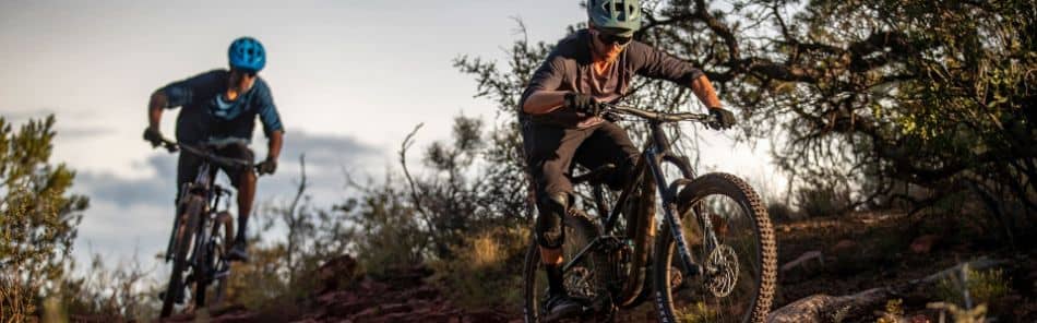 Two riders on Giant mountain bikes on trail