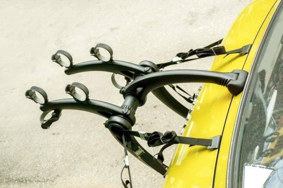 Yellow car with 2 bike trunk rack