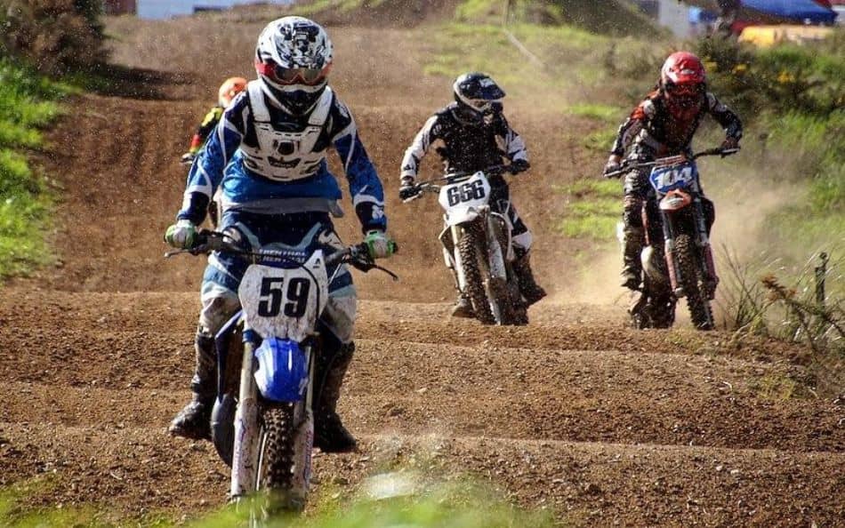Kids hitting the rollers on their dirt bikes