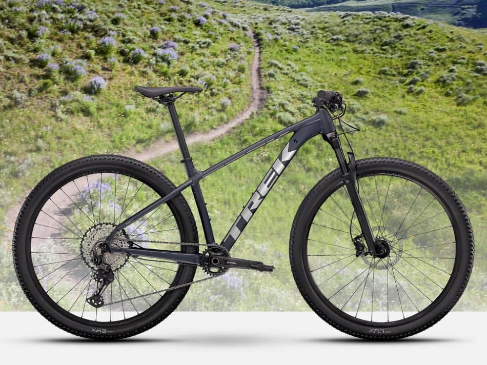 trek hardtail bicycle in front of singletrack mountain bike trail