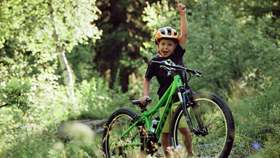 boy on green Scott mountain bike in forest1