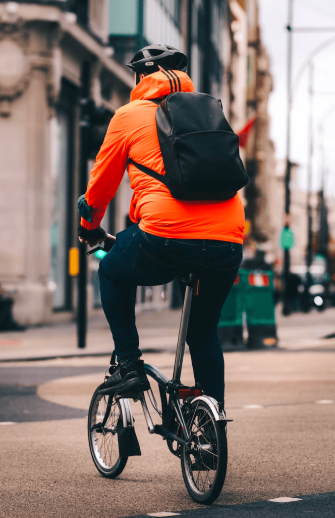 Person riding a bike in a city 3